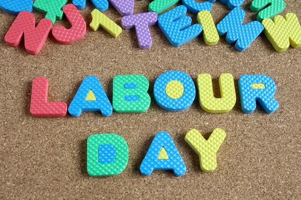 Wording labour day on cork board
