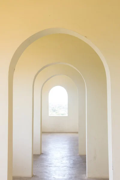 White concrete tunnel door