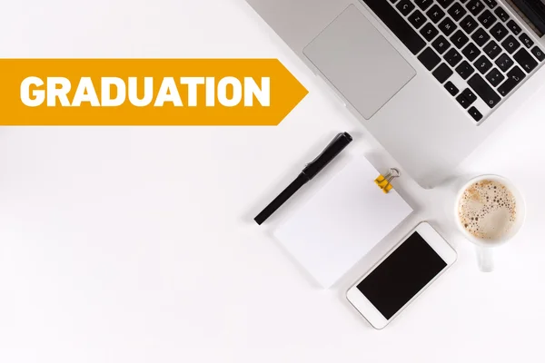 Graduation text on desk with copy space