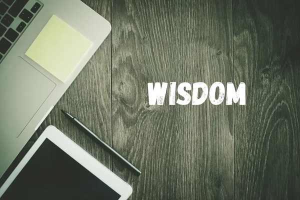 WISDOM text on desk