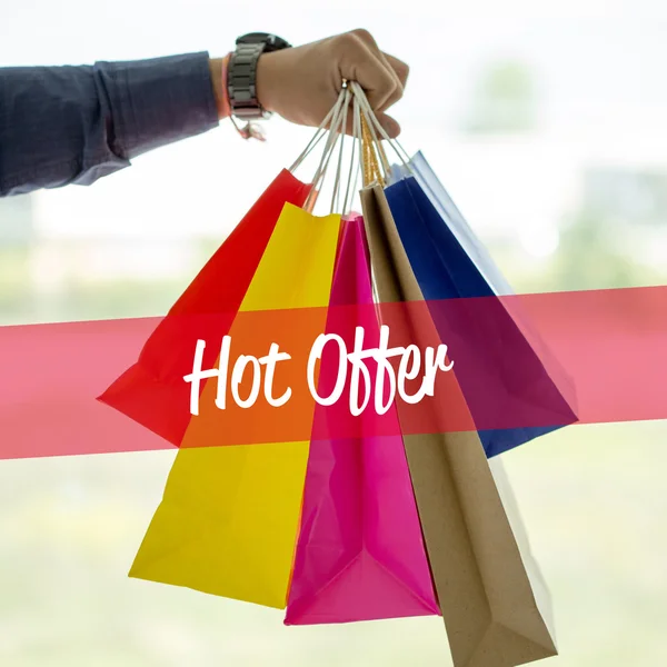 Man holding shopping bags.