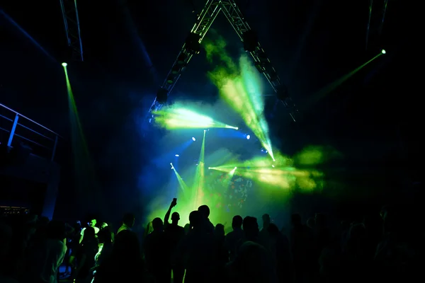 Night club party music concert with crowd of people at the stage