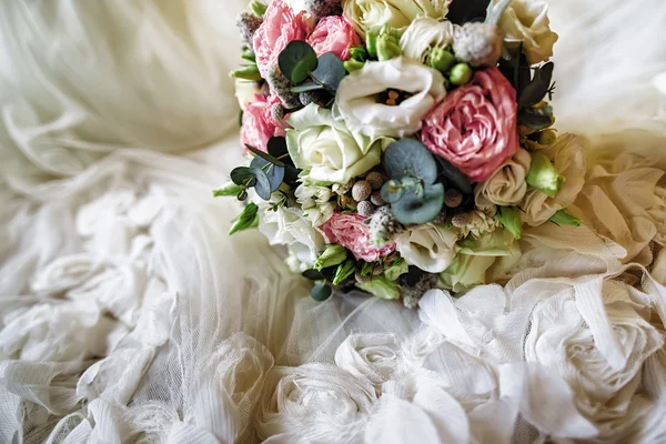 Wedding bride flowers on lacy dress