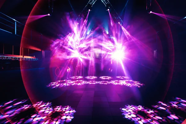 Night party rave concert stage with pink lasers