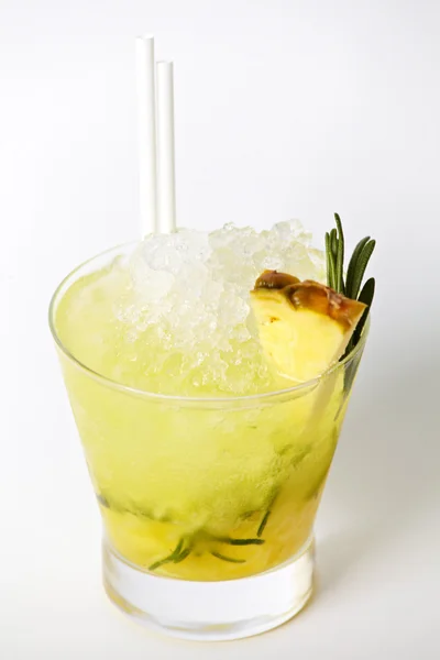 Pineapple cocktail drink with ice and rosemary isolated on white background