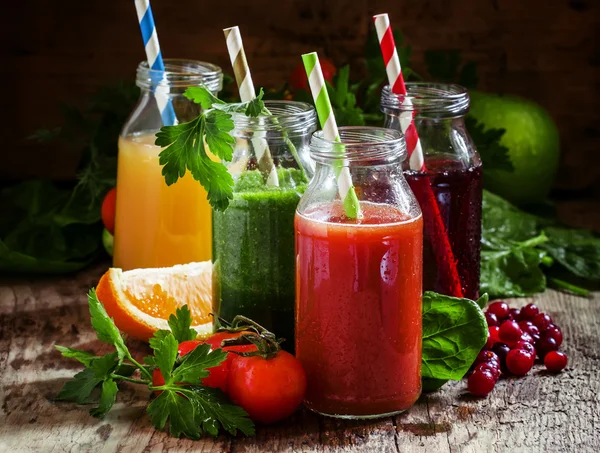 Mix of healthy fruit and vegetable juices in small bottles