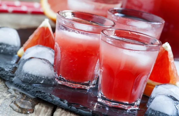 Cool juice from blood orange with ice cubes