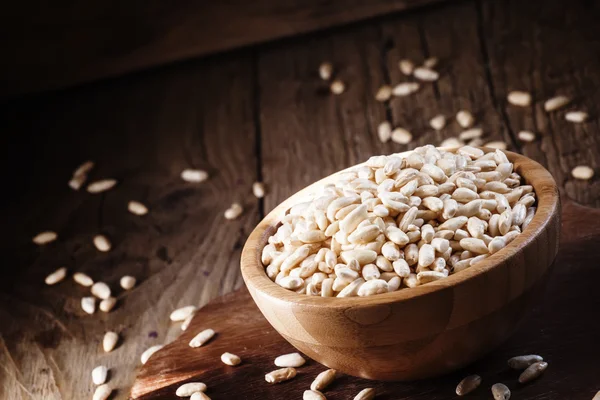 Puffed rice in a wooden bowl