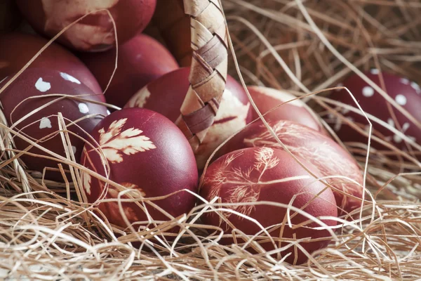 Easter brown egg with a pattern of grass, dyed in onion skins