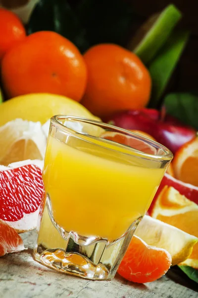 Multifruit citrus cocktail in the big glass beaker