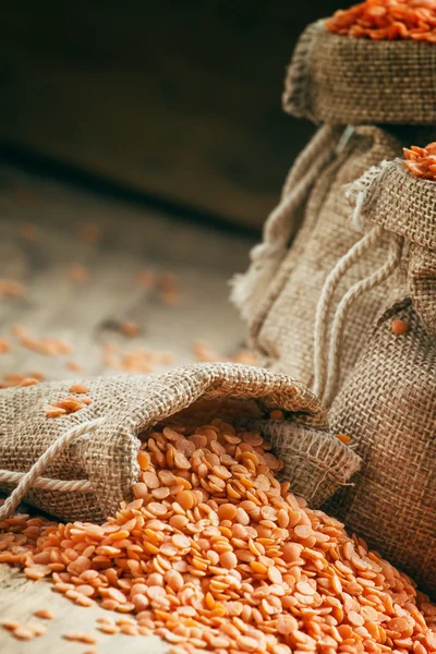 Red lentils in a burlap bags