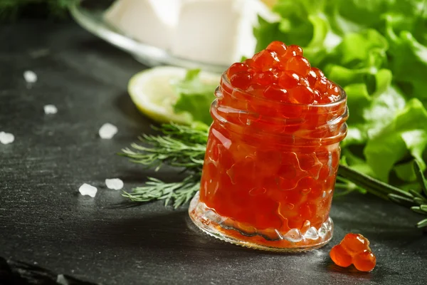 Red caviar with lettuce, dill, rosemary, lemon, sea salt and butter