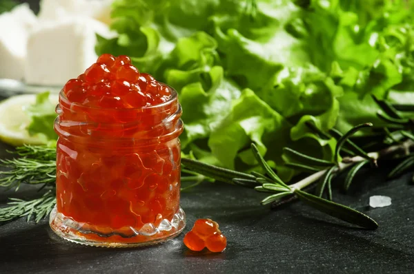 Red caviar with lettuce, dill, rosemary, lemon, sea salt and butter