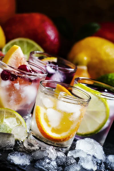 Chilled soft drinks with ice, citrus fruits and berries