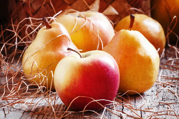 Ripe yellow and red apples and pears