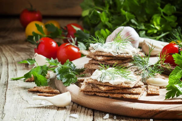 Crispy bread with soft cheese and herbs