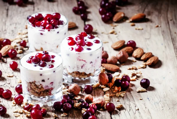 Sweet dessert with cranberries, yogurt, cereal, oatmeal and nuts