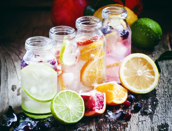 Fizzy water with citrus fruit, fresh berries and crushed ice