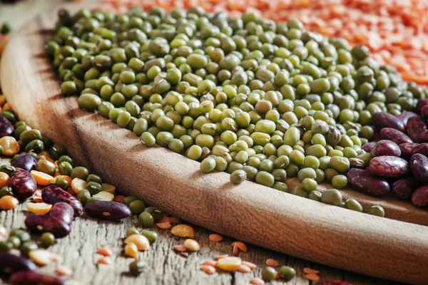 Green lentils on a vintage wooden background