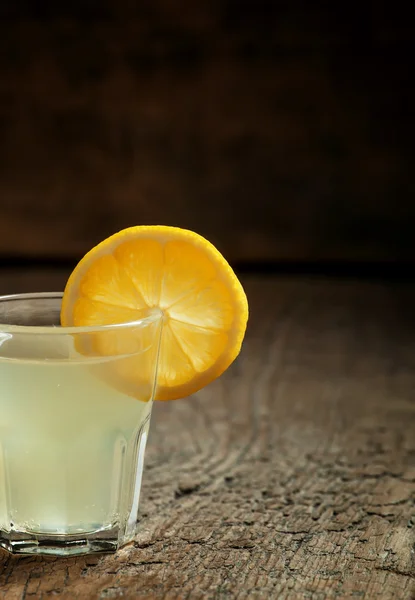 Single glass of vodka with lemon