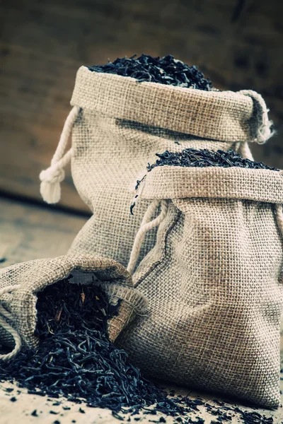 Dry black Indian tea in a burlap bags