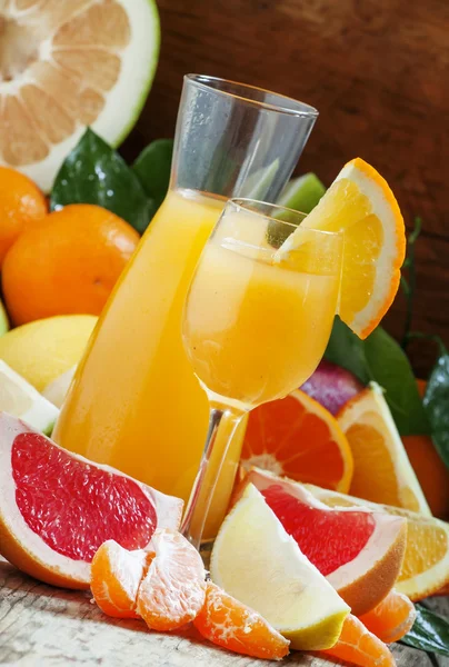 Freshly squeezed citrus juice with pulp and fruit pieces