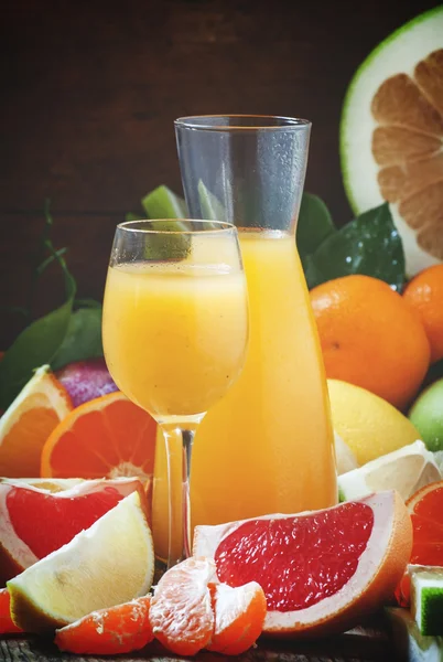 Freshly squeezed citrus juice with pulp and fruit pieces