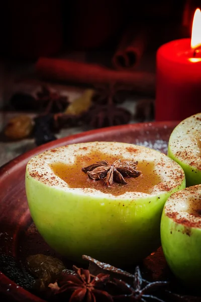 Apple cider apples in halves with cinnamon and anise