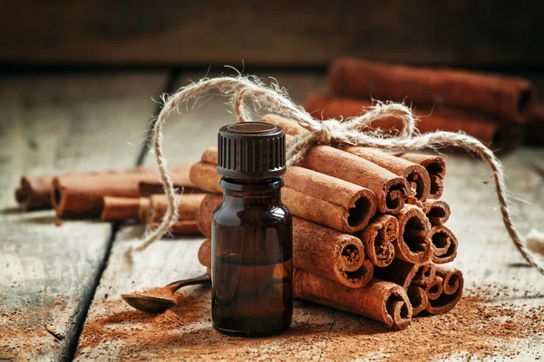 Essential cinnamon oil in a small bottle