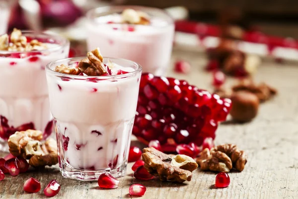 Homemade yogurt with walnuts and pomegranate seeds