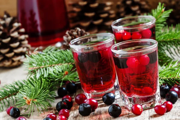 Winter drink with cranberries, cowberries and black chokeberries