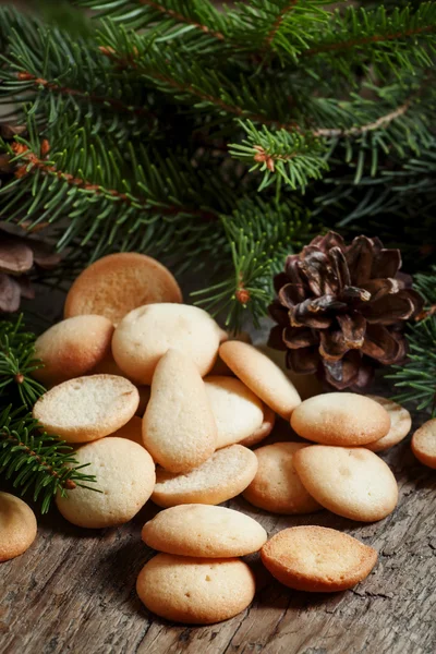 Christmas round gingerbread cookies, cones and spruce branches
