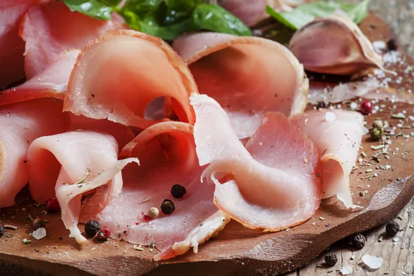 Slices of smoked ham on a cutting board