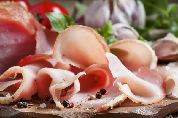 Slices of smoked ham on a cutting board