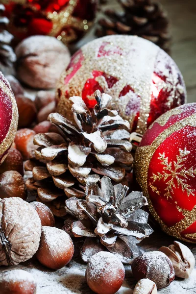 Christmas background with snow-covered fir cones