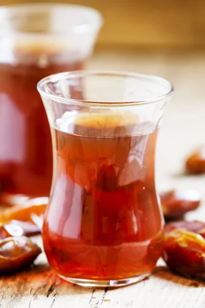 Two cups of black tea  in traditional Islamic cups