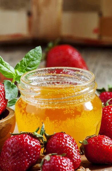 Jar of honey, strawberries, muesli, milk bottle