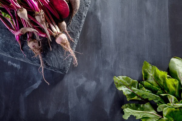 Preparing healthy, vegetarian food on blackboard