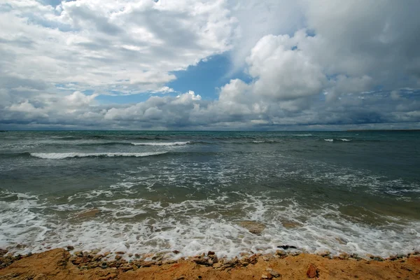 Sea surf and clouds