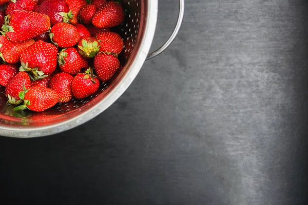 Strawberries on a black desktop background
