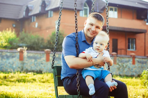 Father hugs and holds a child and rejoices