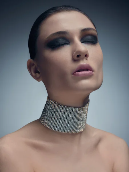 Glamour model in necklace of Swarovski crystals