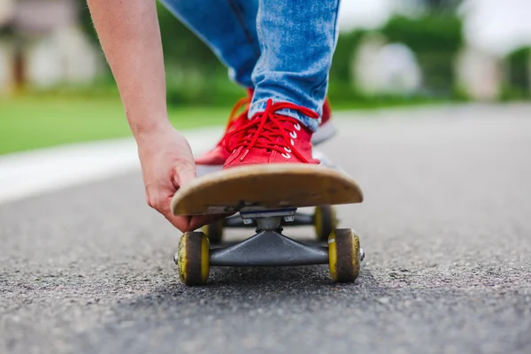 Skateboarder riding skateboard through the street