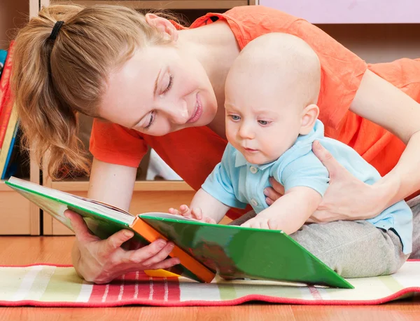 Mother and baby reading together