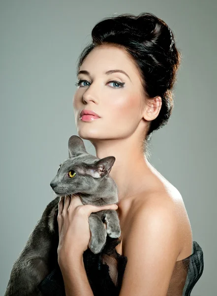 Fashionable woman with cat