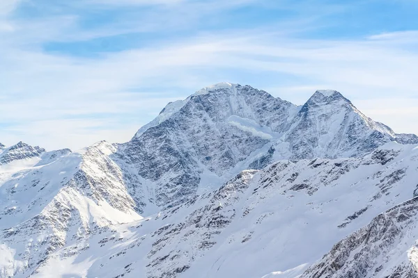 Snowed Mountain peaks in the Caucasus in anticipation of skiers