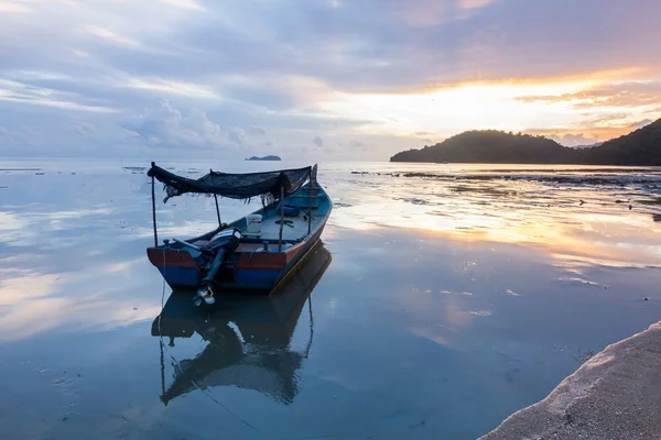 Sunrise by the beach with boat in George Town, Penang Malaysia
