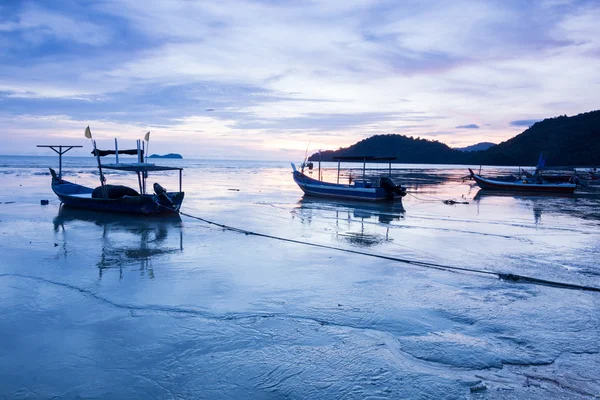 Sunrise by the beach with boat in George Town, Penang Malaysia