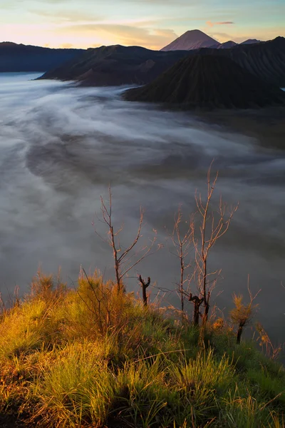 Sunrise Mountains.Bali Nature Morning Volcano Viewpoint.Mountain Trekking, View Landscape. Nobody photo. The first rays of the rising sun. Vertical picture.