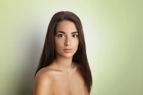 Portrait Handsome Pretty Young Lady Long Hair Empty Green Background.Beauty,Grooming,Fashion People Photo.Sexy Woman Smiling Camera Studio Shot.Horizontal Image.Soft Light Shadows Effect.